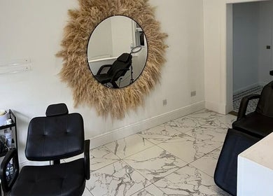 Modern salon seating at The Brow & Lash Lab ByElle, Edinburgh, Scotland, GB featuring stylish decor.