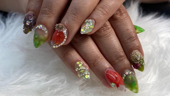 Colorful crystal-embellished nails from Nails by Goddess Lynx, La Plata, Maryland, US, featuring vibrant designs.