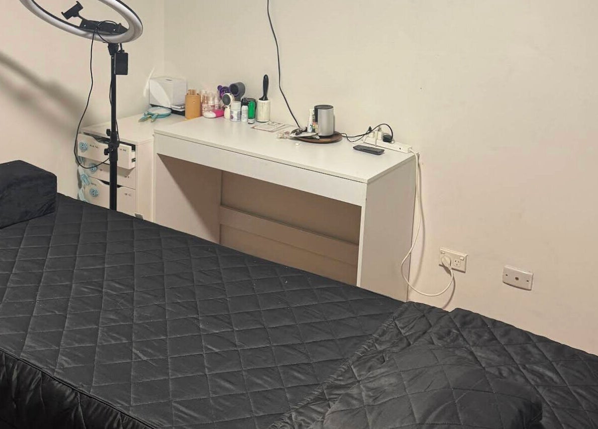 Cozy treatment room at Lash Studio By Jenny in Bertram, Western Australia, AU with a comfortable black bed.