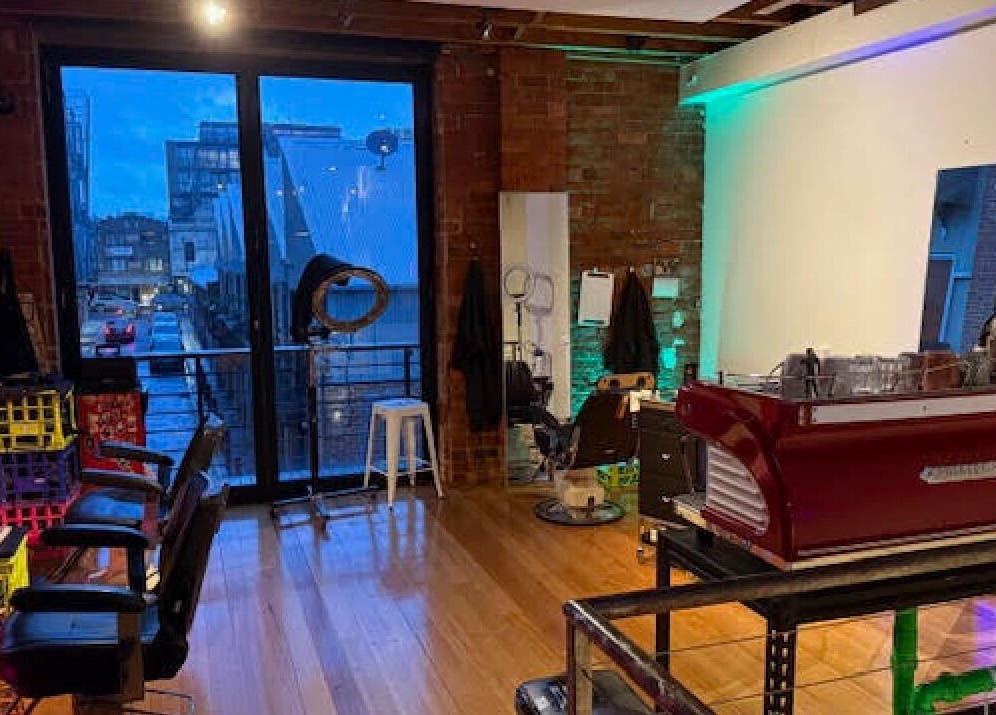 Cozy interior of Hair Agenda in Prahran, Victoria, AU with stylish chairs and modern decor.