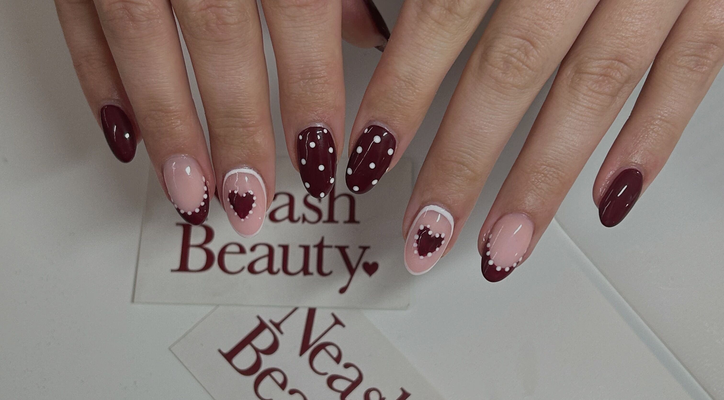 Beautiful heart-themed nail art at Neash Beauty, Kiama, New South Wales, AU.