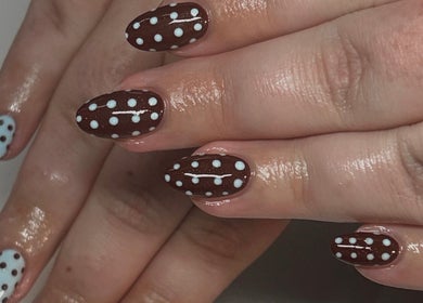 Stylish polka dot nail art at Neash Beauty, Kiama, New South Wales, AU.