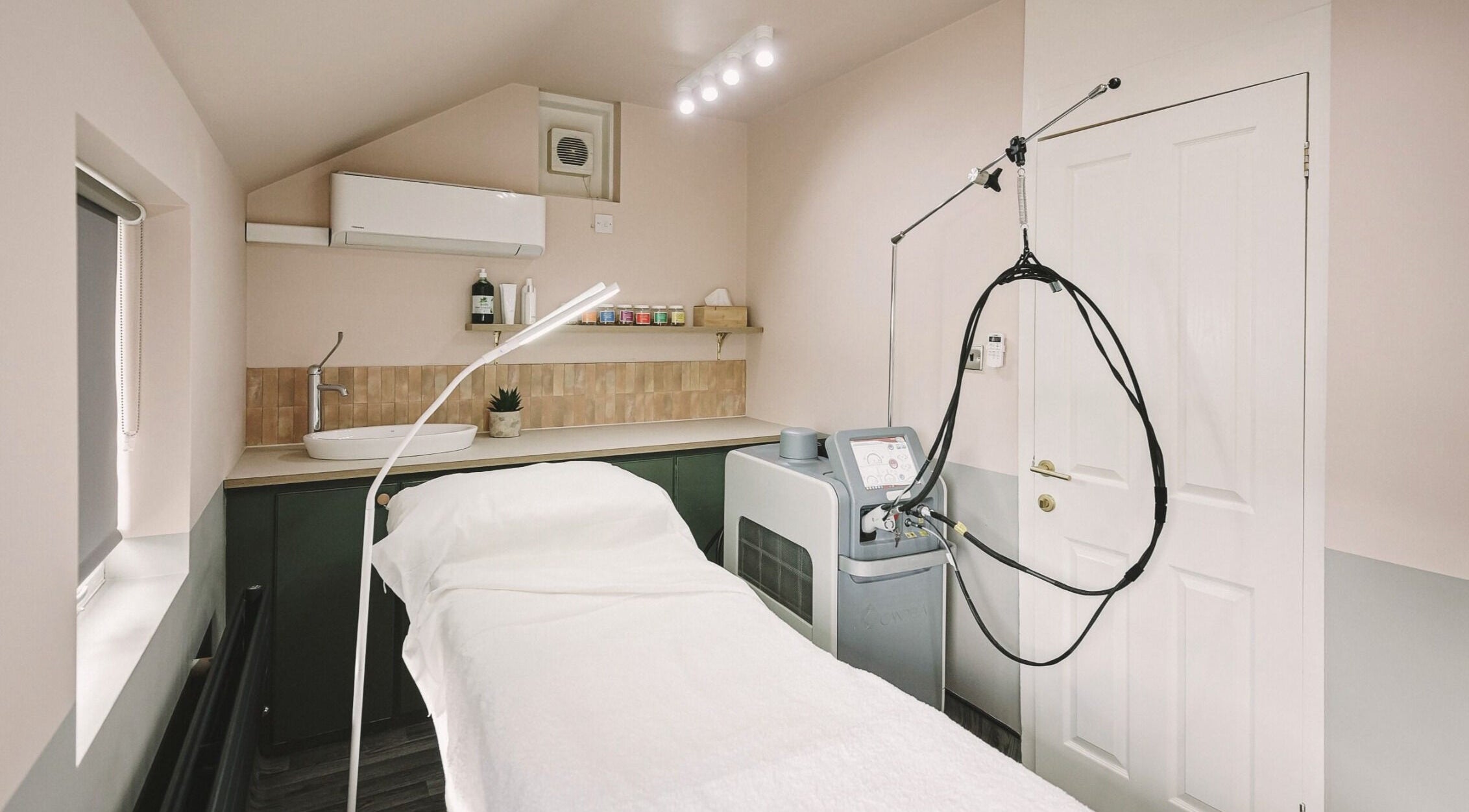 Cozy treatment room at Cecily Skin Clinic & Koha Aesthetics, Berkhamsted, England, GB featuring modern equipment.