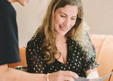 Smiling client during consultation at Cecily Skin Clinic & Koha Aesthetics, Berkhamsted, England, GB.