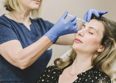 Aesthetic treatment at Cecily Skin Clinic & Koha Aesthetics in Berkhamsted, England, GB. Woman receiving face injection.