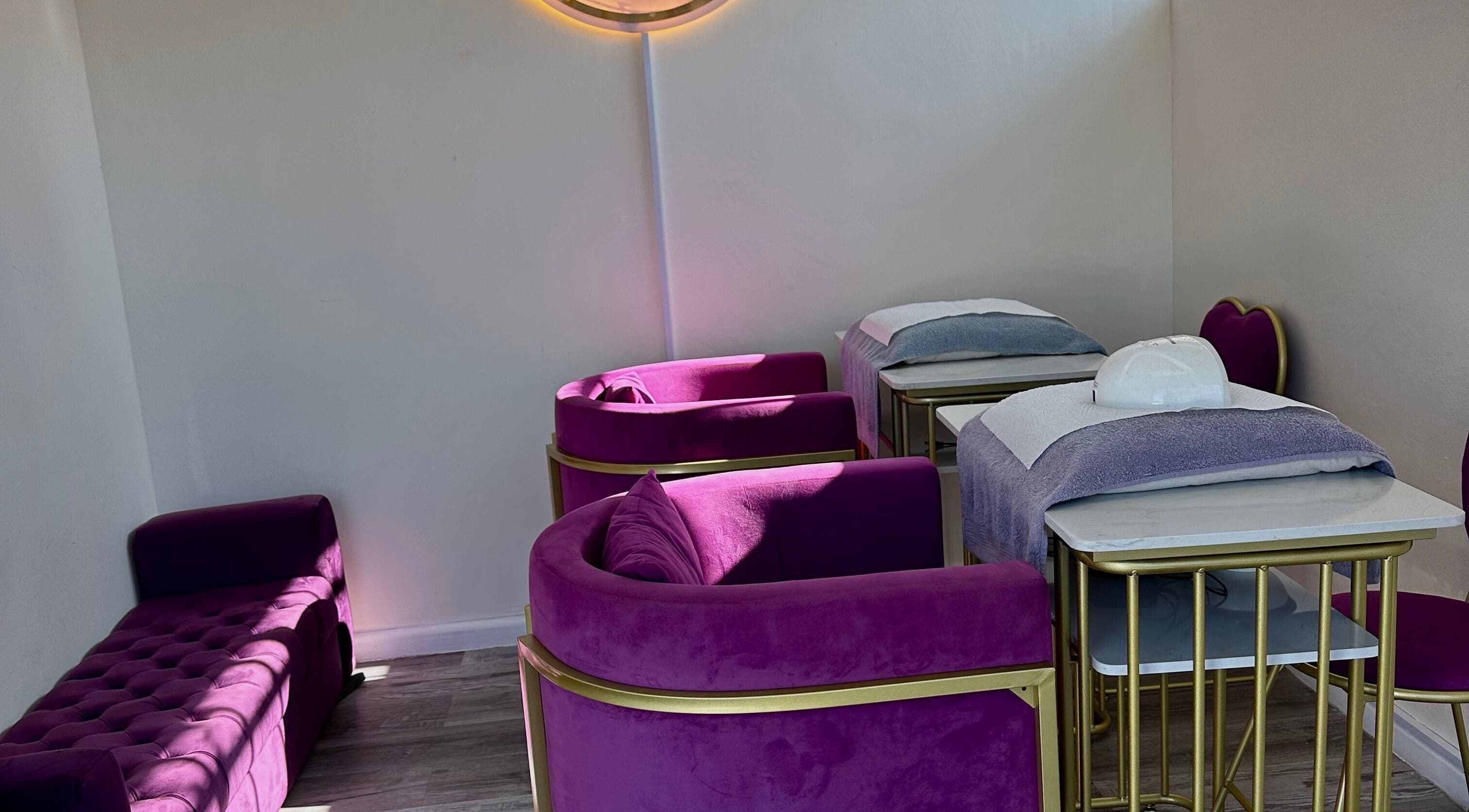 Cozy nail salon area with plush violet chairs at Phezulu beauty and spa, Cape Town, Western Cape, ZA.
