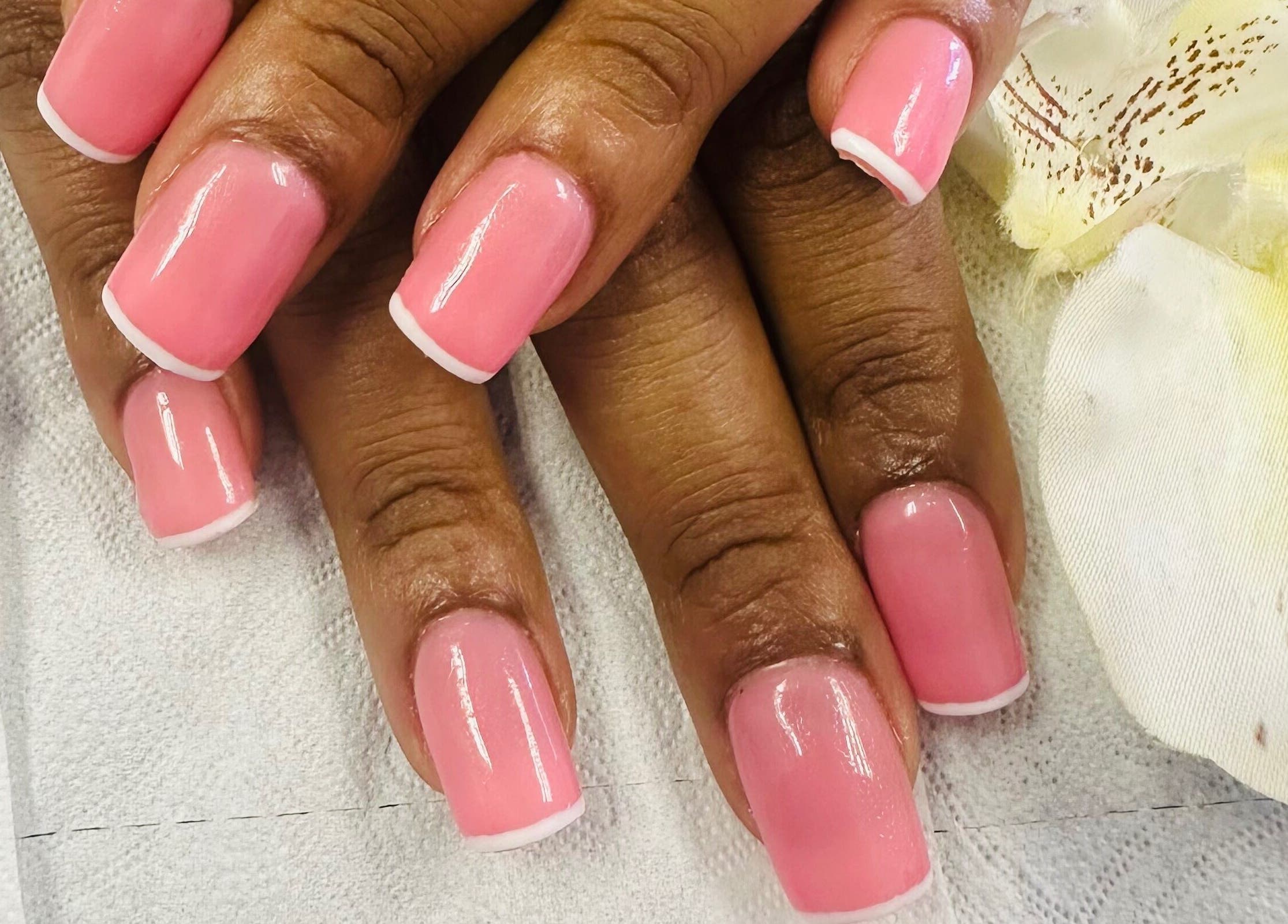 Elegant pink manicure at Phezulu beauty and spa, Cape Town, Western Cape, ZA, showcasing delicate nail art.