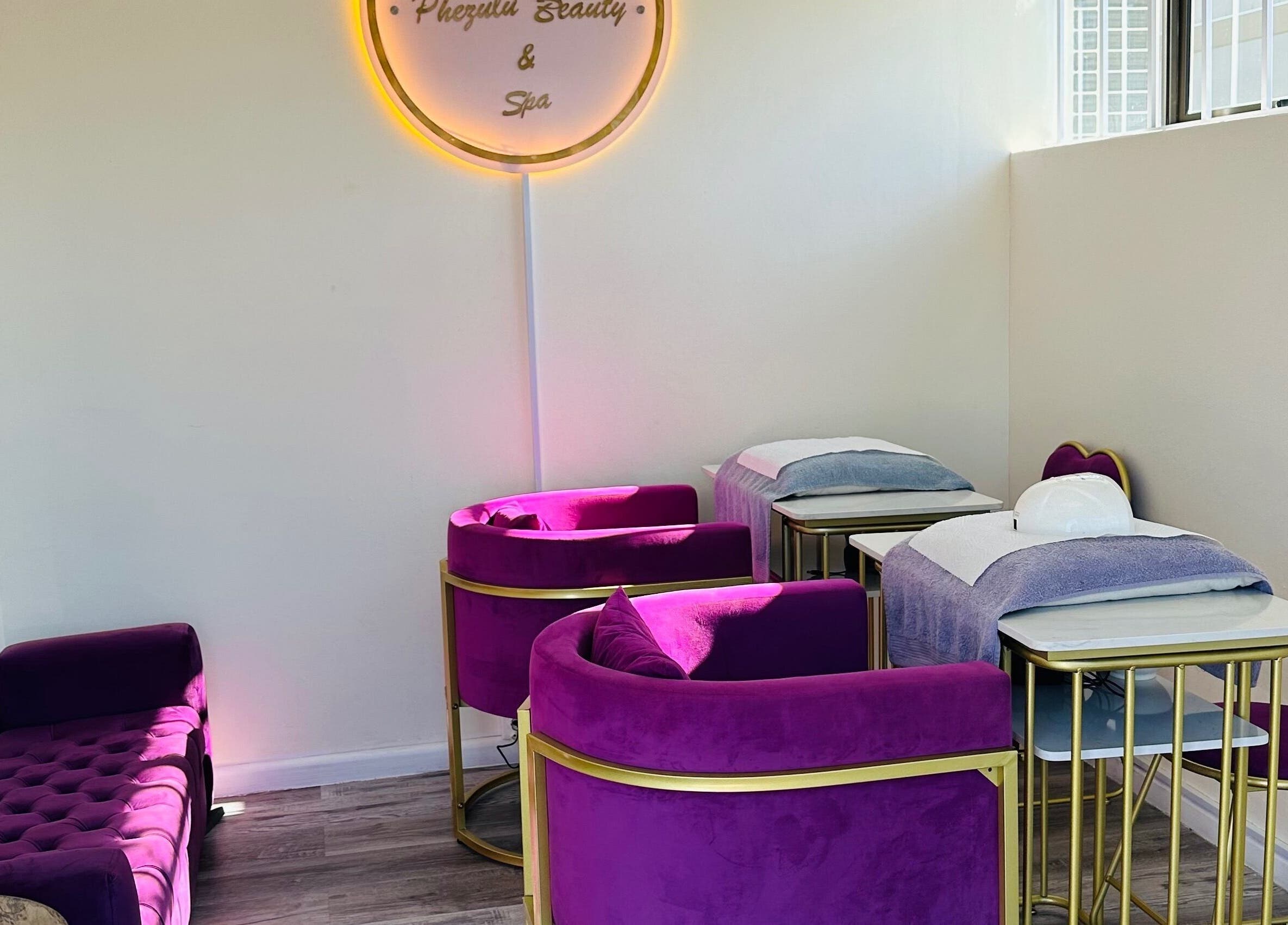 Purple chairs and beds at Phezulu Beauty and Spa, Cape Town, Western Cape, ZA, offering elegance and comfort.
