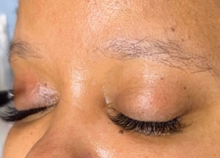 Eyelash extension service at Phezulu beauty and spa, Cape Town, Western Cape, ZA, showcasing precise brushwork.