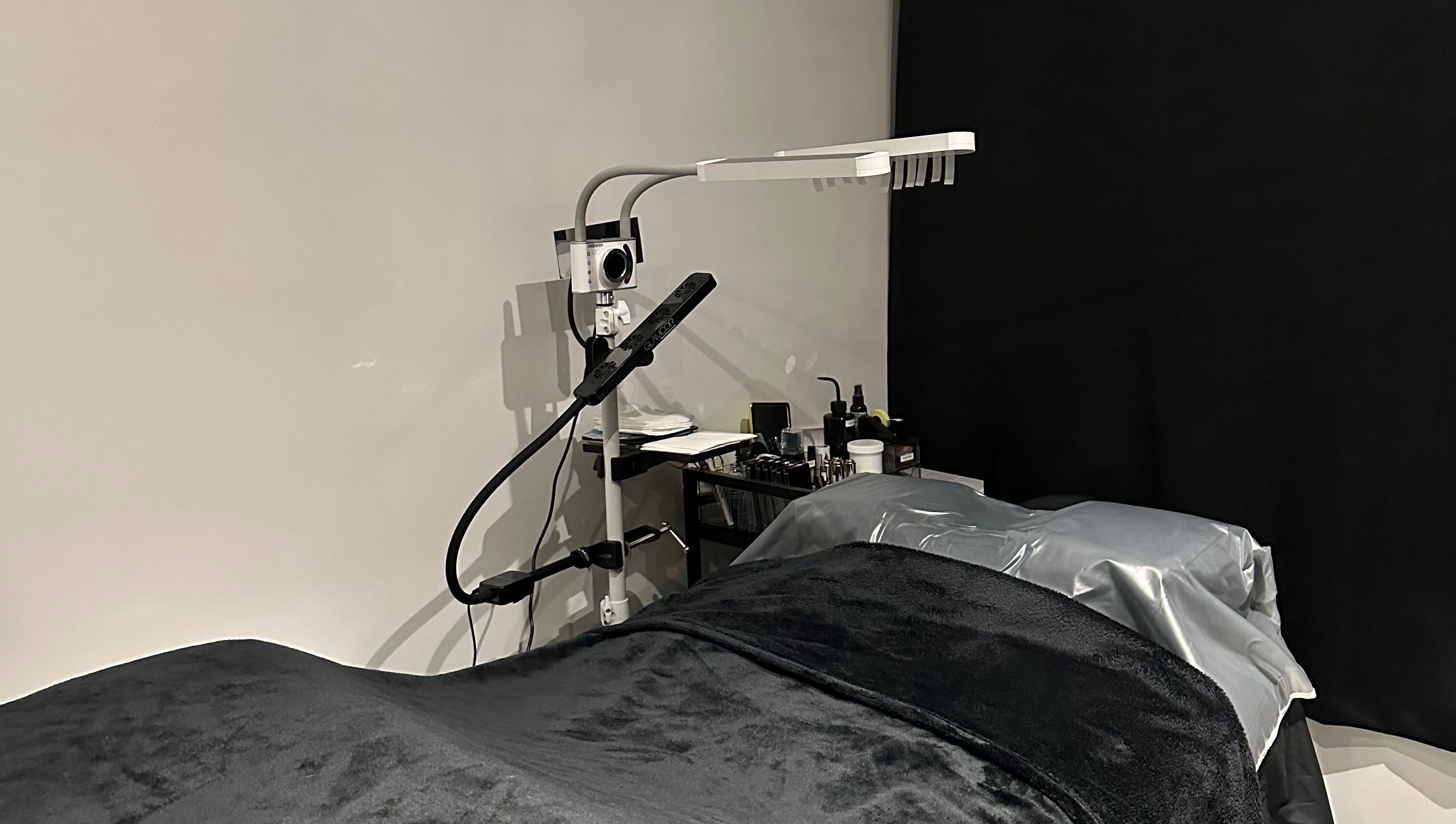 Tranquil lash treatment room at Lash Me, Hounslow, England, GB with cozy bed and professional lighting.