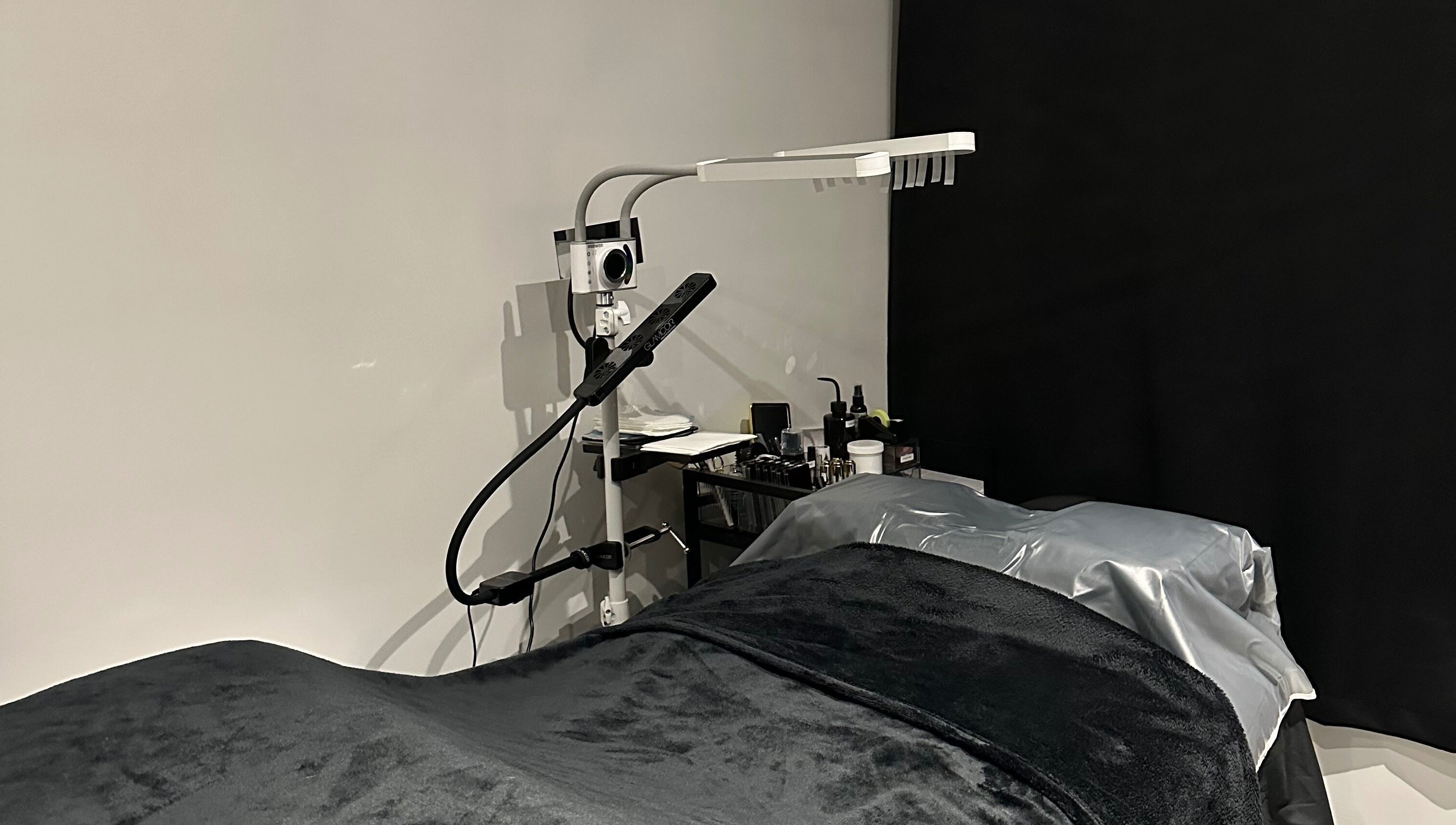 Tranquil lash treatment room at Lash Me, Hounslow, England, GB with cozy bed and professional lighting.