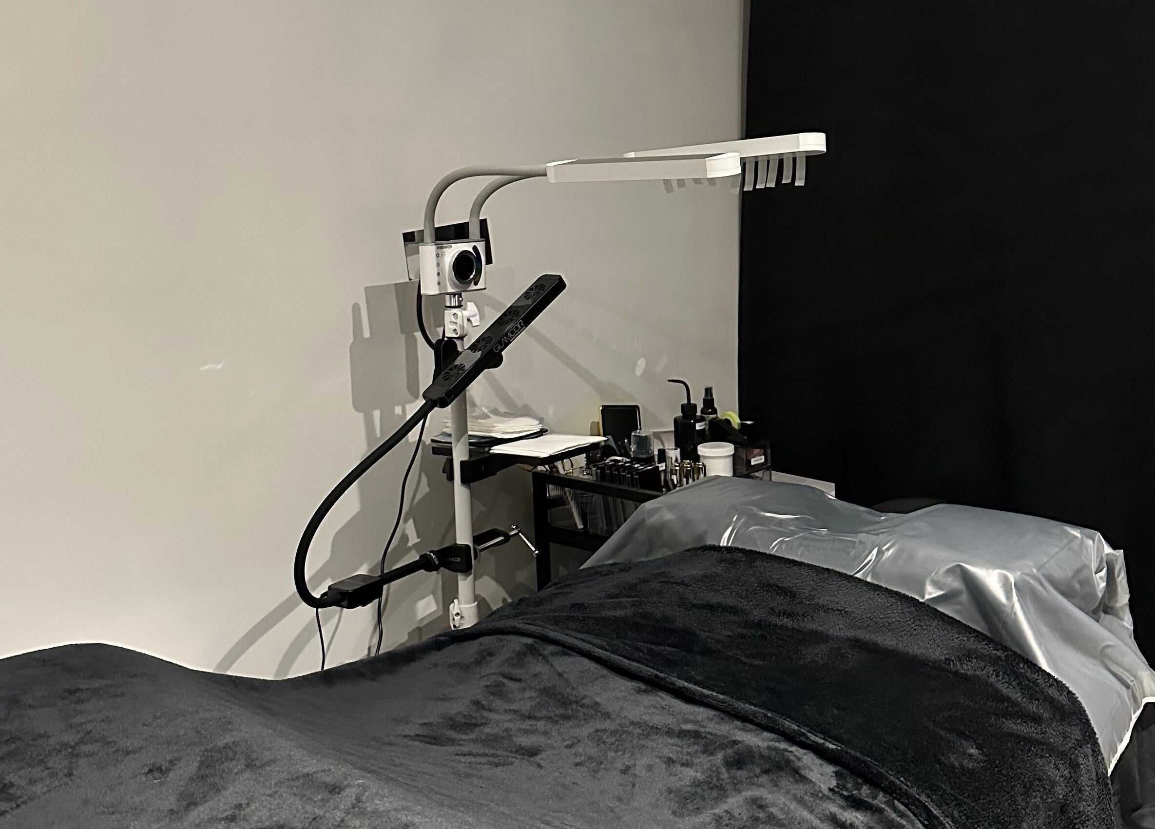 Tranquil lash treatment room at Lash Me, Hounslow, England, GB with cozy bed and professional lighting.