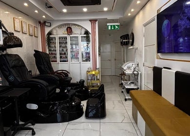 Interior of Inspiration Nail, Hair and Beauty salon in Isleworth, England, featuring elegant chairs and decor.