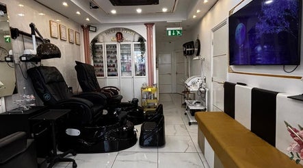 Interior of Inspiration Nail, Hair and Beauty salon in Isleworth, England, featuring elegant chairs and decor.