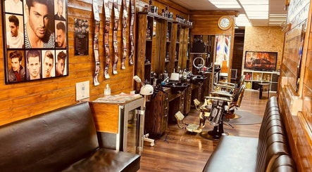 Interior of Ultimate Crown Barber with wooden decor, chairs, styled wall art, Forest Hall, England, GB.