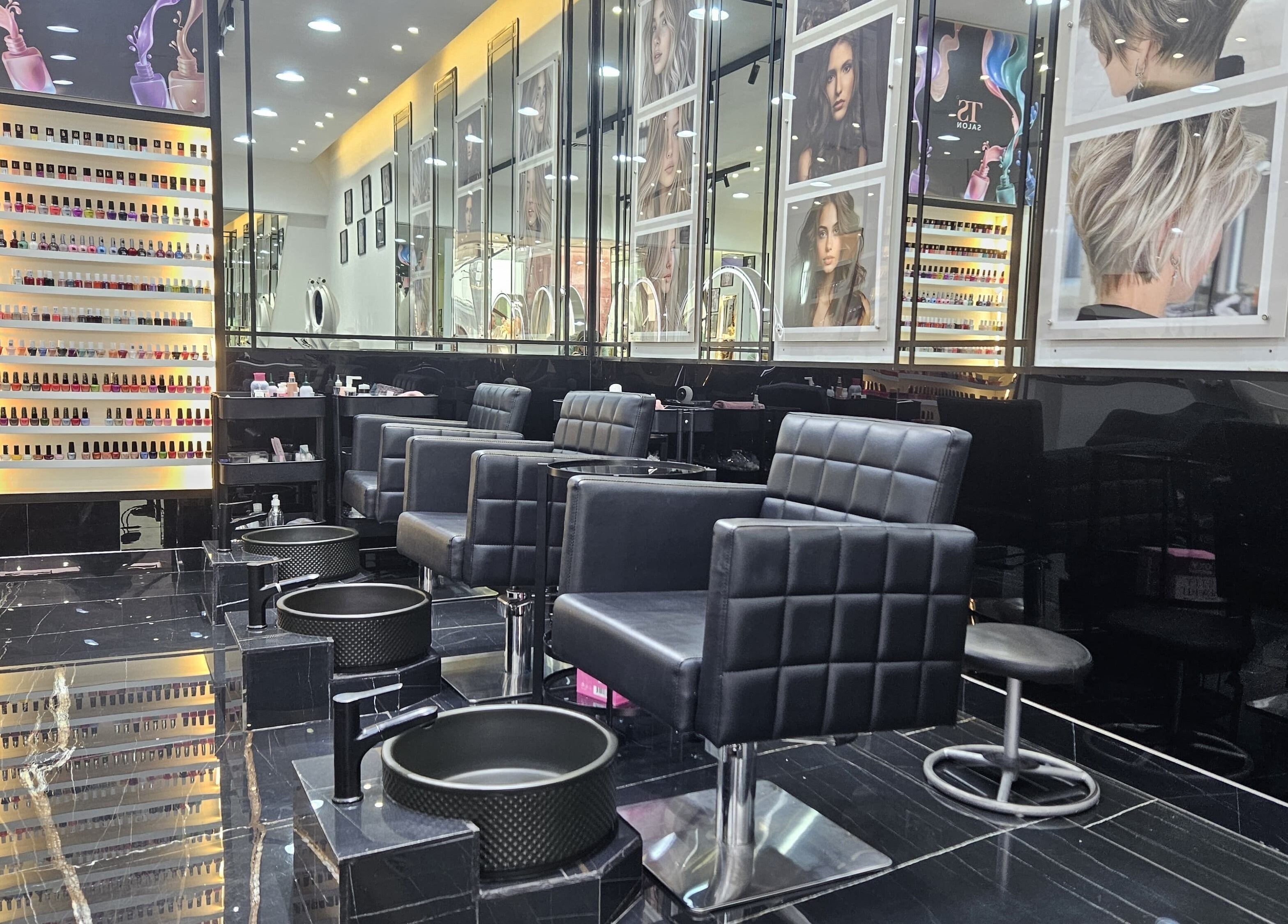 Modern styling chairs at Top Style Ladies Saloon, Dubai, AE, with vibrant nail polish display.