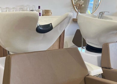 Elegant salon shampoo stations at Esthétic Hair, Peacehaven, England, GB offer a luxurious hair-washing experience.