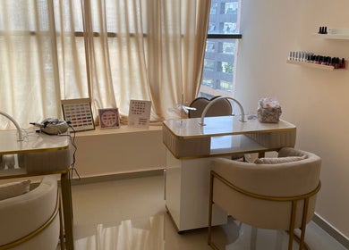 Elegant nail care room at Wellness Palace, Casablanca, Casablanca-settat, MA with cozy chairs and manicure tables.