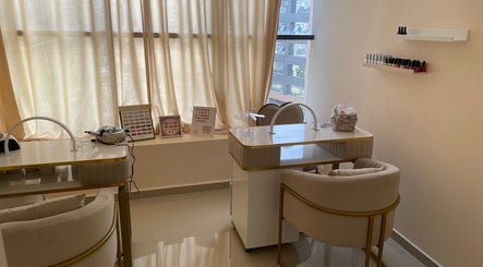 Elegant nail care room at Wellness Palace, Casablanca, Casablanca-settat, MA with cozy chairs and manicure tables.