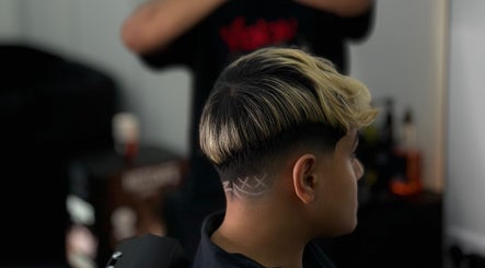 Trendy hairstyle with a fade design at Venom Salon, Dubai, Dubai, AE.