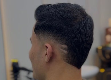 Modern fade haircut at Venom Salon in Dubai, Dubai, AE, showcasing expert styling and precision.