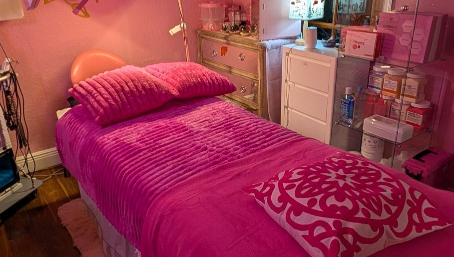 Cozy treatment room with pink bedding at Bardon Beauty, Lauderdale-by-the-sea, Florida, US.