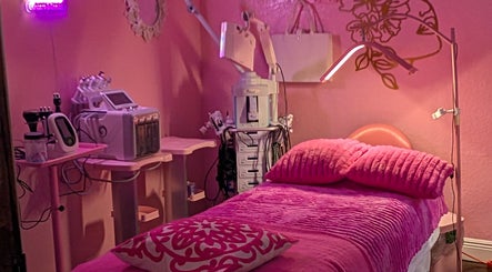 Cozy pink treatment room at Bardon Beauty, Lauderdale-by-the-sea, Florida. Modern equipment and plush bedding showcased.