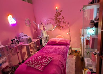 A cozy, pink-themed treatment room at Bardon Beauty in Lauderdale-by-the-sea, Florida, US.