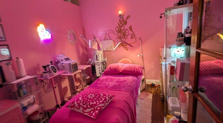A cozy, pink-themed treatment room at Bardon Beauty in Lauderdale-by-the-sea, Florida, US.