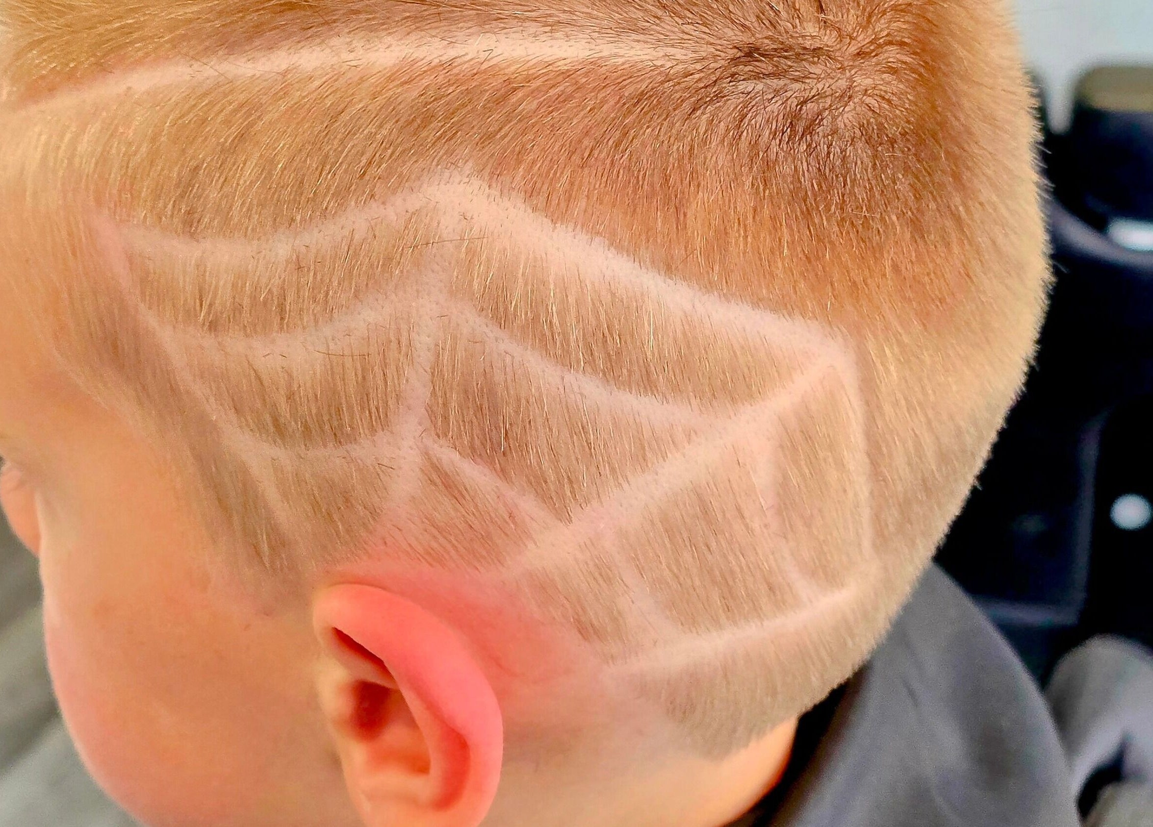 Intricate hair design at Fandvstudio, Macclesfield, England, GB showcasing expert barbering skills.