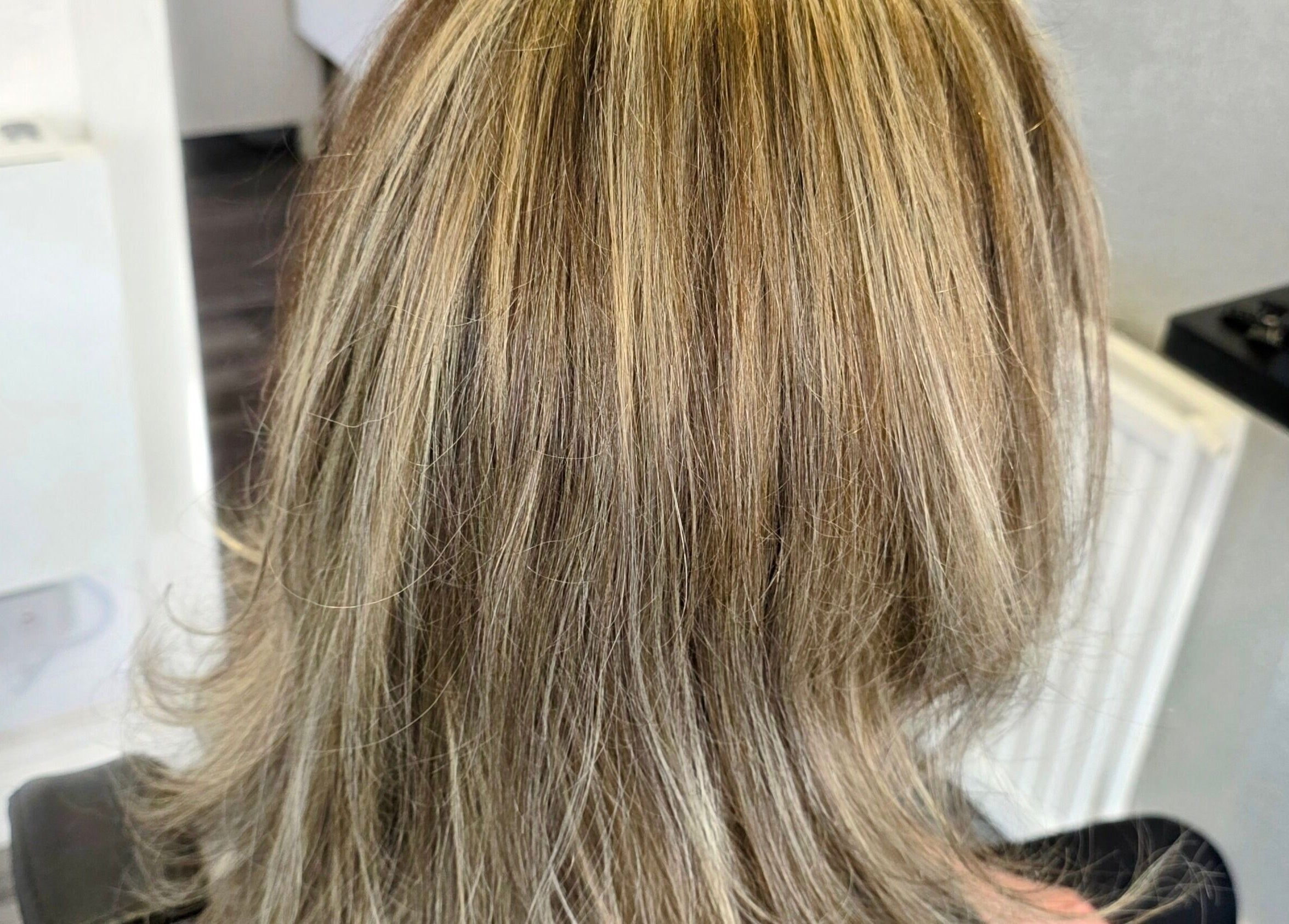 Blonde highlights hairstyle at Fandvstudio, Macclesfield, England, GB, showcasing expert salon techniques.
