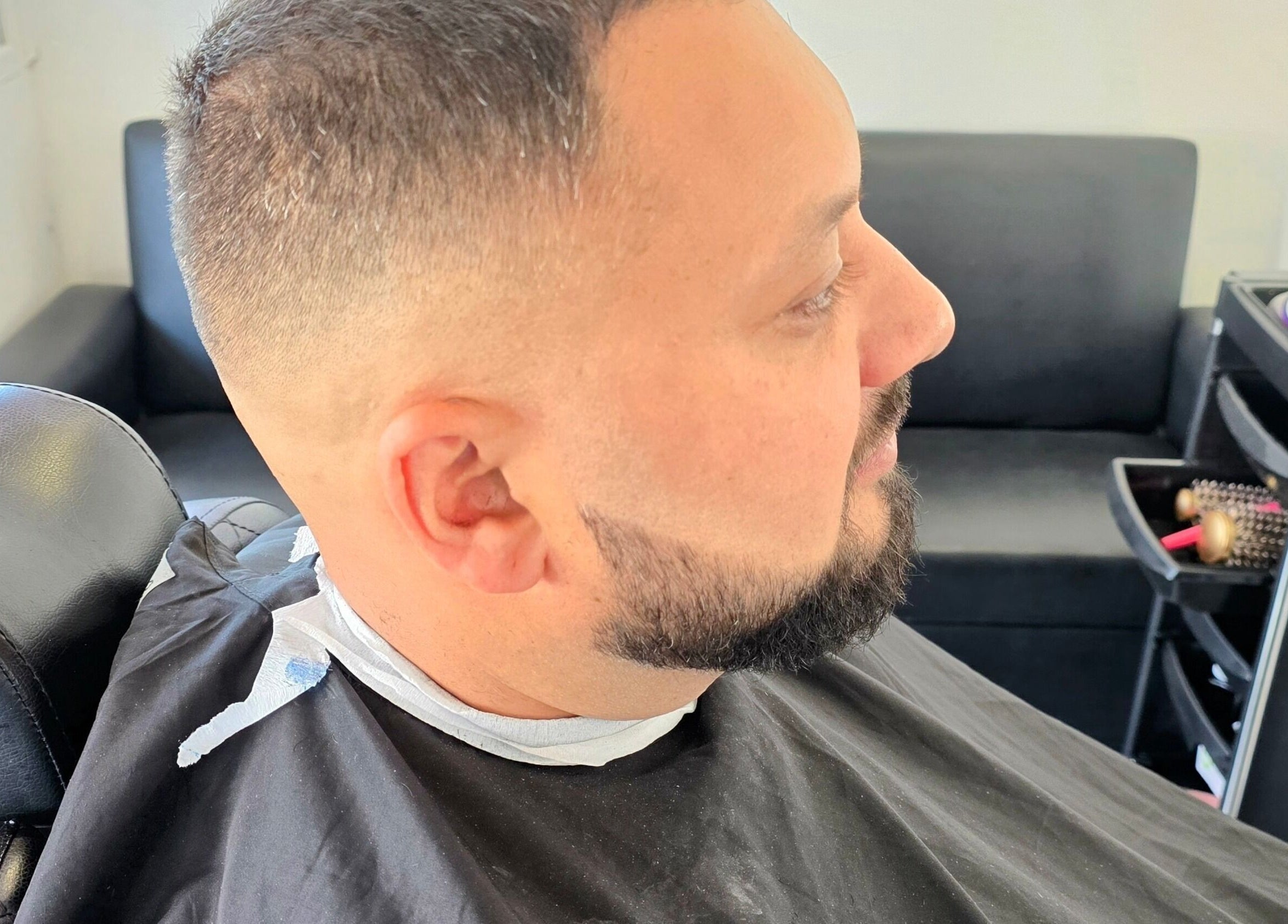 Close-up of a man's fresh fade haircut at Fandvstudio, Macclesfield, England, GB, showing expert styling.