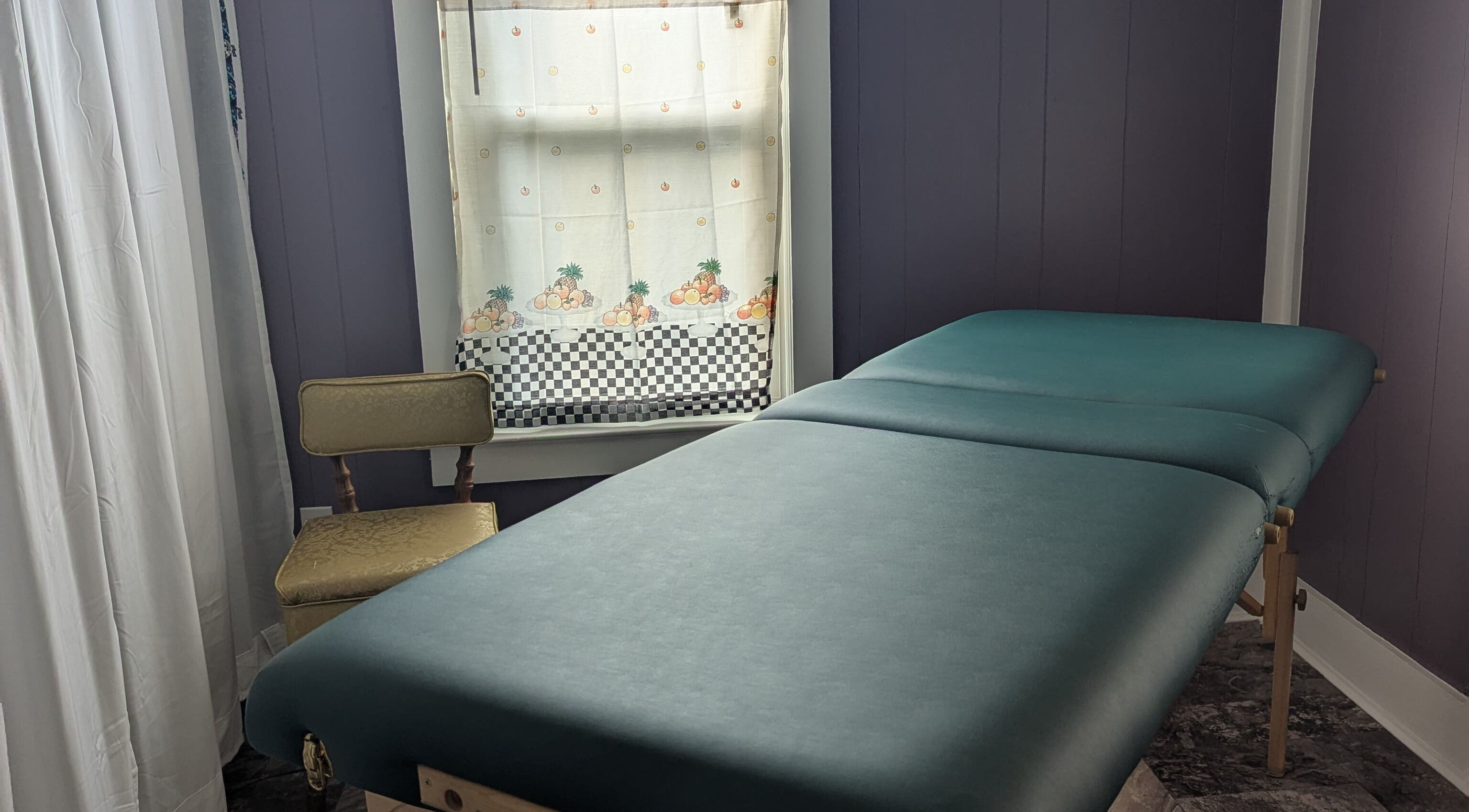Peaceful treatment room at Waxed Fruit Studio LLC, Endicott, New York, US, featuring a comfortable massage table.