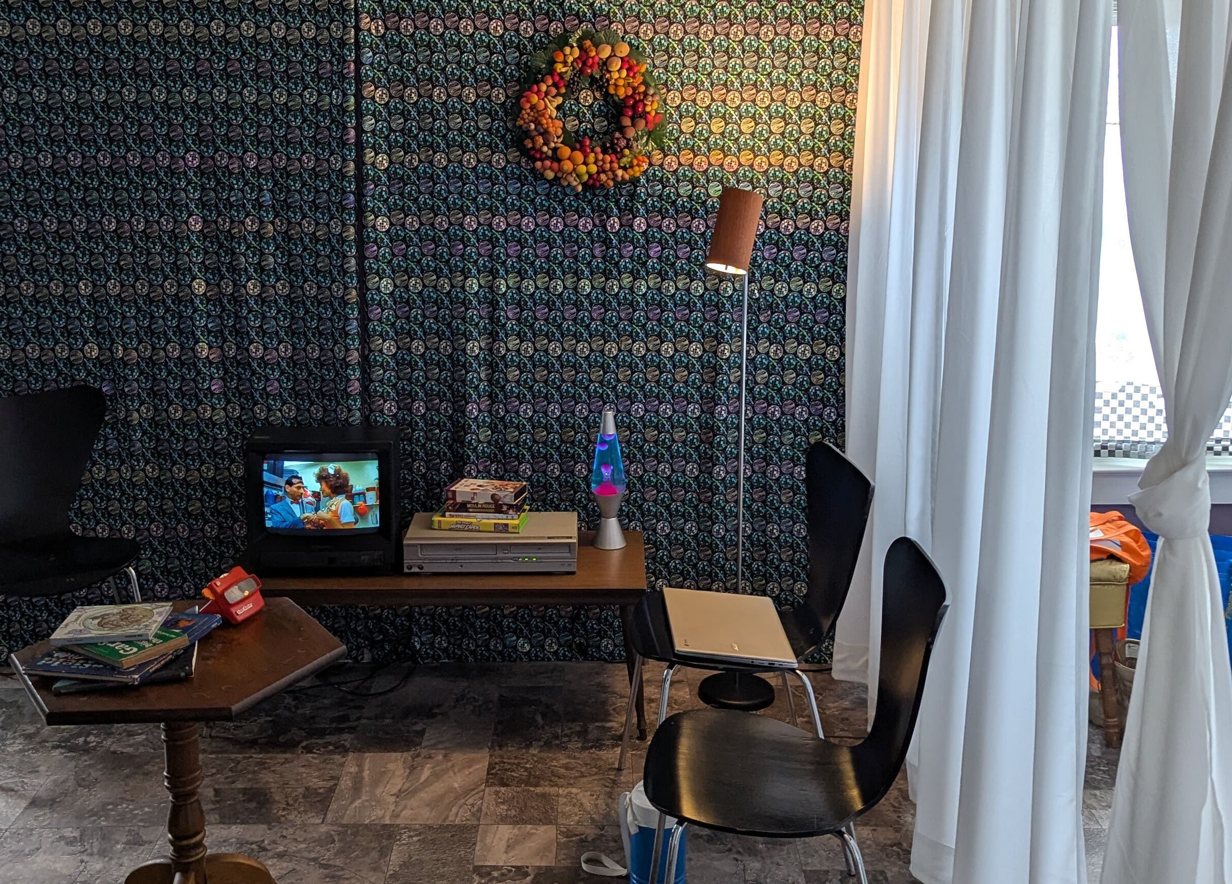 Relaxing corner with TV and decor at Waxed Fruit Studio LLC in Endicott, New York, US.