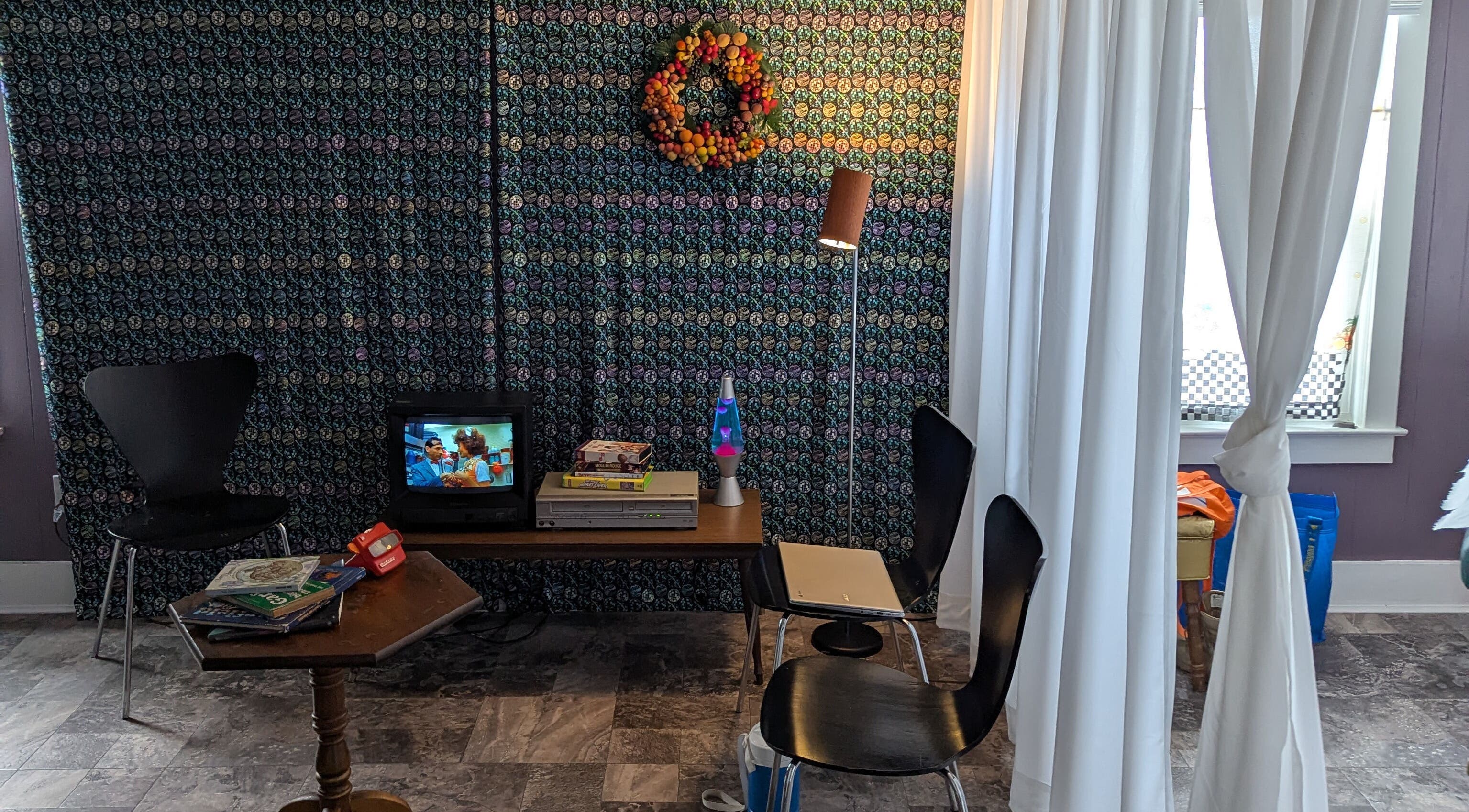 Relaxing corner with TV and decor at Waxed Fruit Studio LLC in Endicott, New York, US.