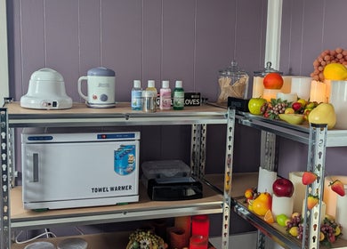 Spa tools and decor at Waxed Fruit Studio LLC, Endicott, New York, US enhance a serene atmosphere.