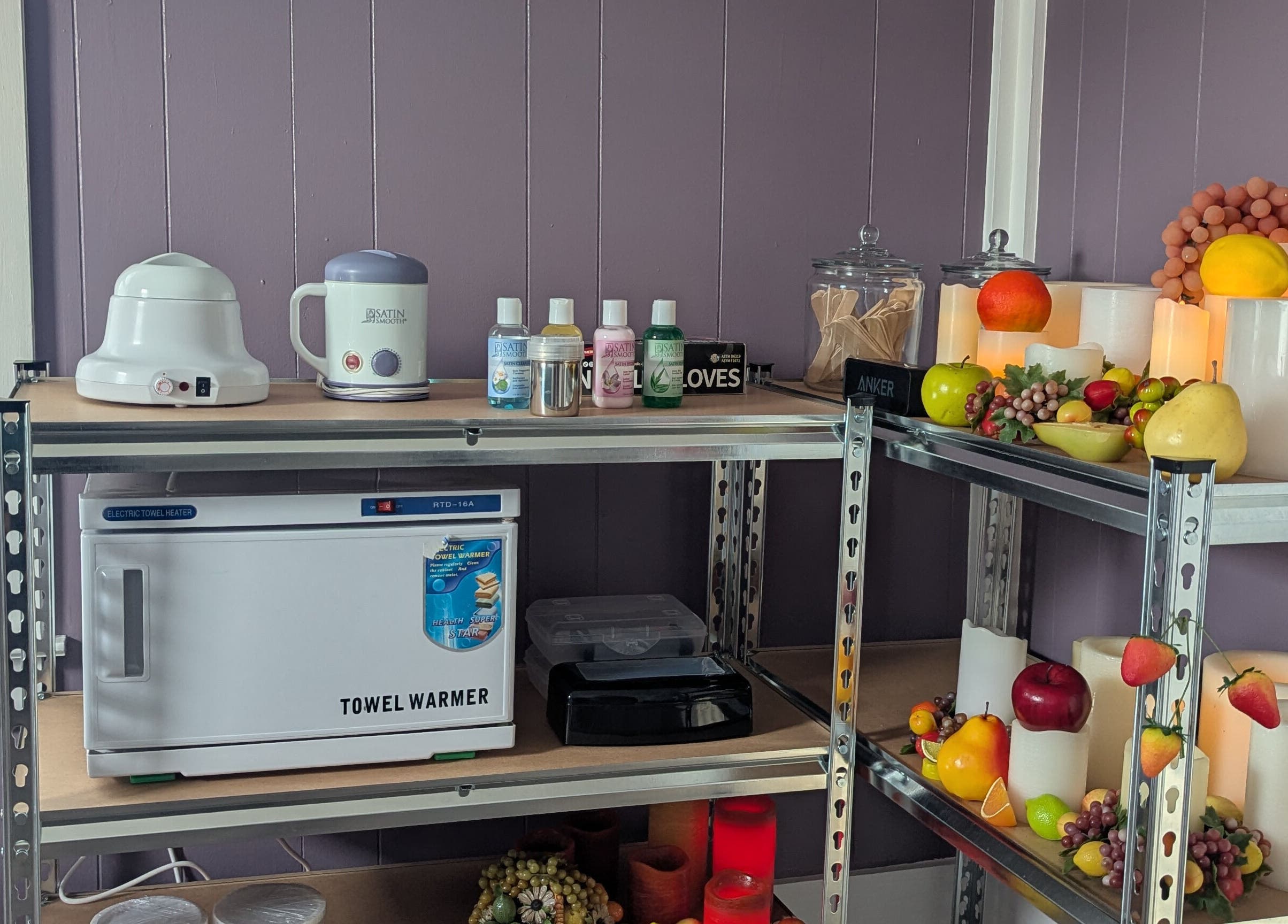 Spa tools and decor at Waxed Fruit Studio LLC, Endicott, New York, US enhance a serene atmosphere.