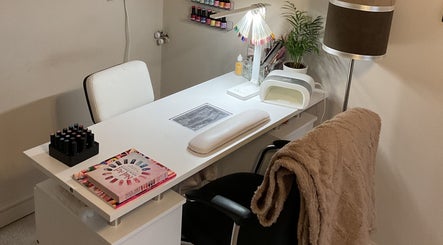 Nail care station at KH Beauty & Body Studio, Mosborough, England, GB, featuring neatly organized polish and tools.