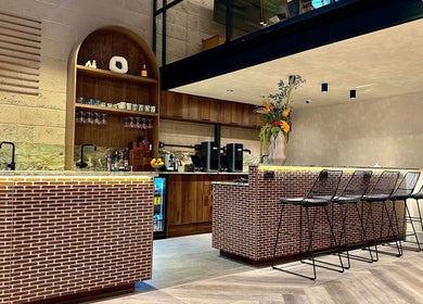 Modern bar counter with seating at Annette Linn Hair, London, England, GB.