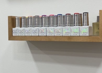 Stylish nail polish collection on a shelf at By Kayleigh Marie, Gateshead, England, GB.