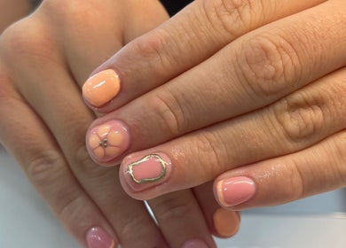 Elegant nail art with peach and pink tones at By Kayleigh Marie, Gateshead, England, GB.