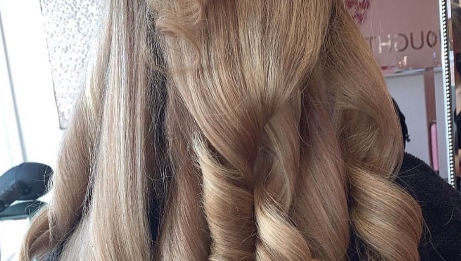 Elegant curls styled at Sunlux Tanning & Beauty in Preston, England, GB, showcasing expert hair design.