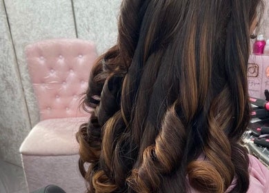 Elegant curled hairstyle at Sunlux Tanning & Beauty, Preston, England. Perfect for a stylish makeover.