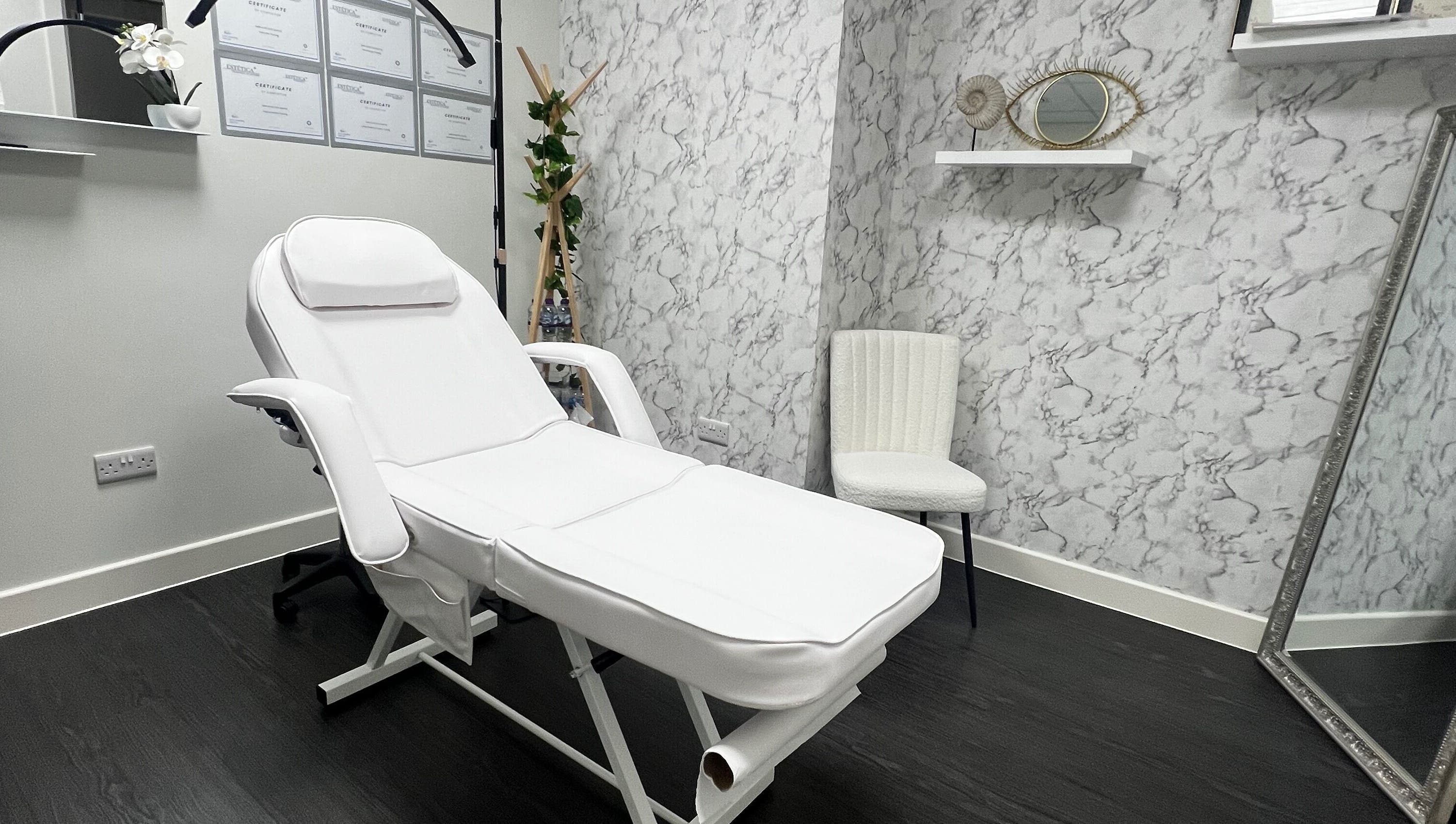 Relaxing treatment room at Aesthetic by Sara Alves, Liverpool, England, GB, with a luxurious white spa chair.