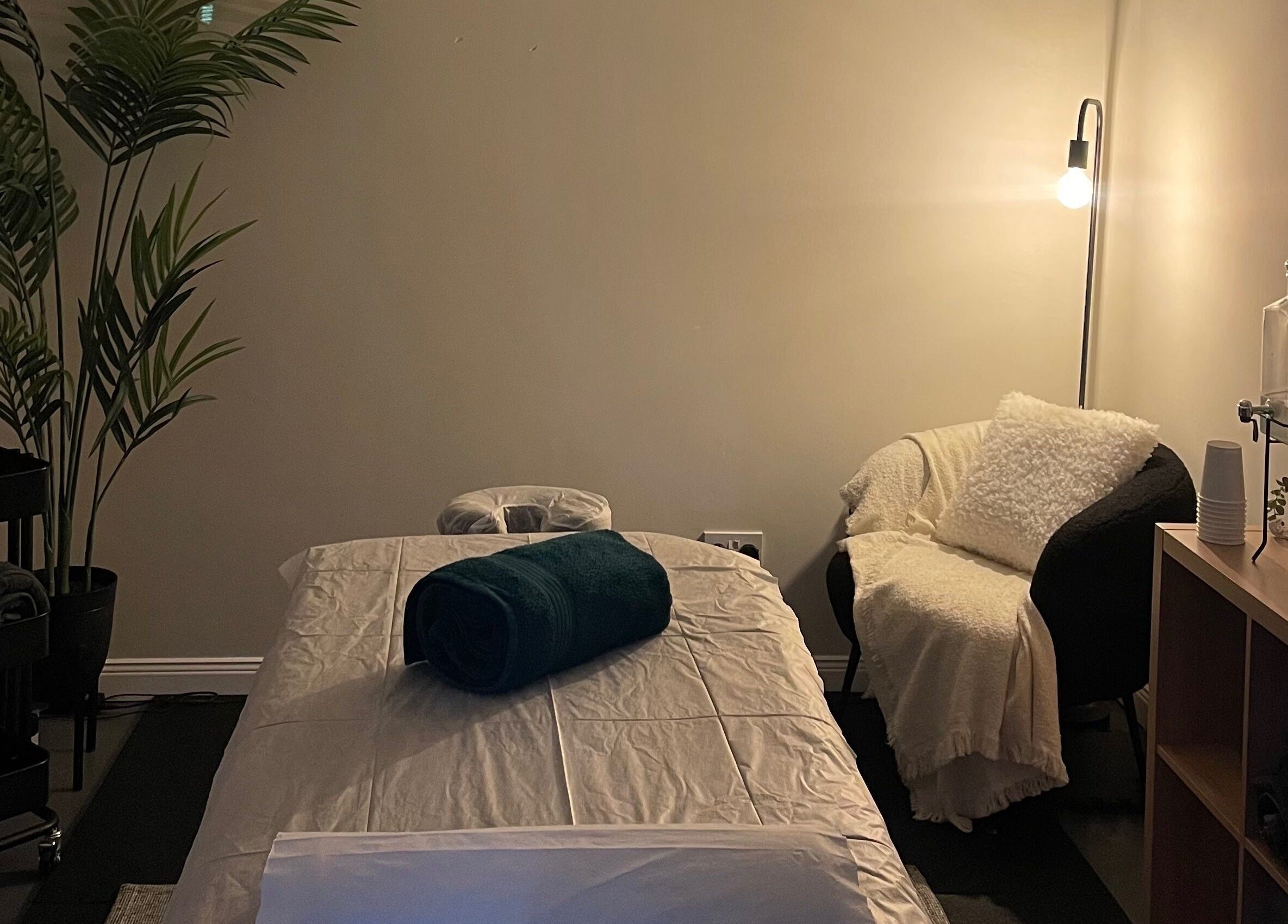 Relax and Recover treatment room in Bangor, Northern Ireland, GB with cozy lighting and a plush treatment bed.