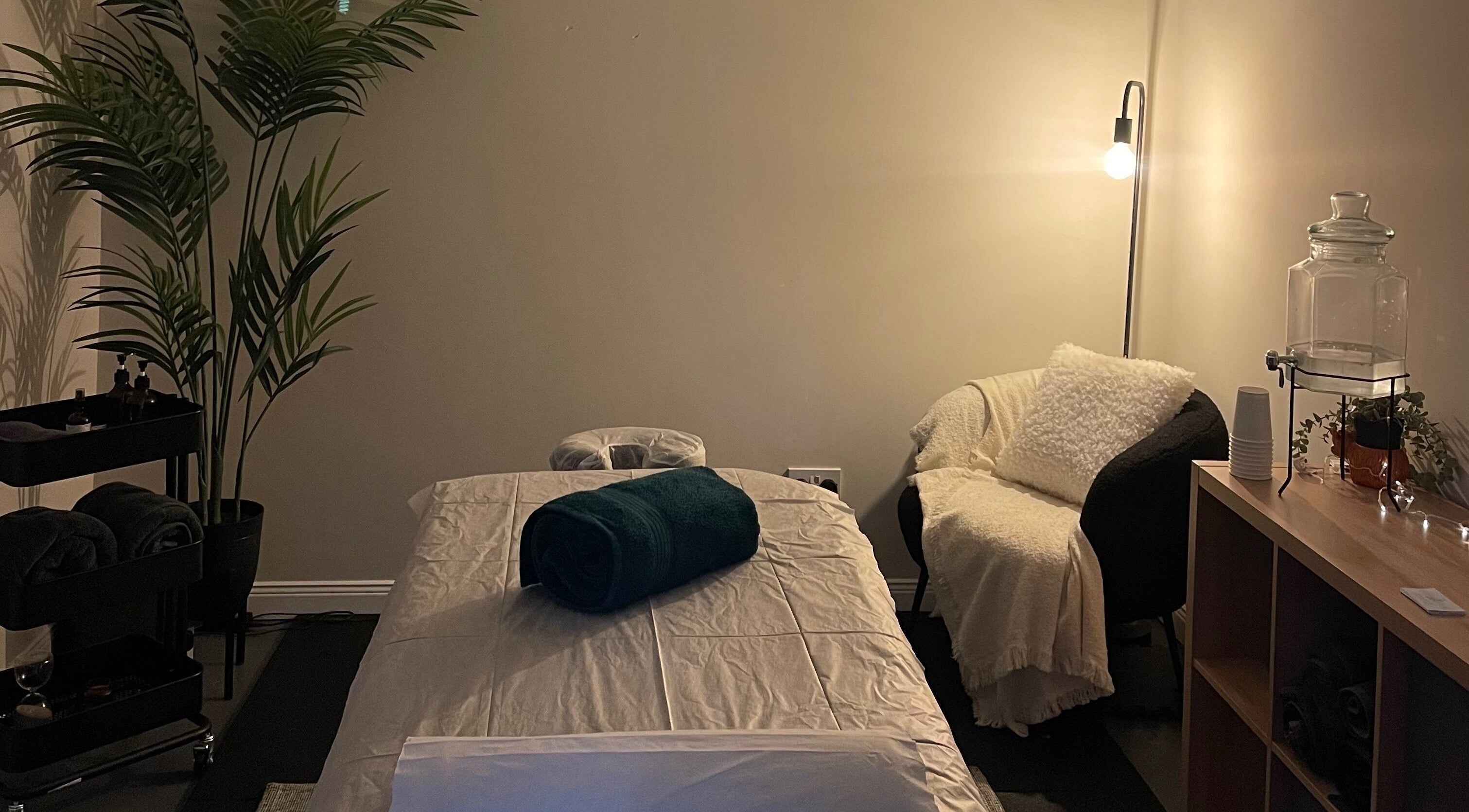 Relax and Recover treatment room in Bangor, Northern Ireland, GB with cozy lighting and a plush treatment bed.
