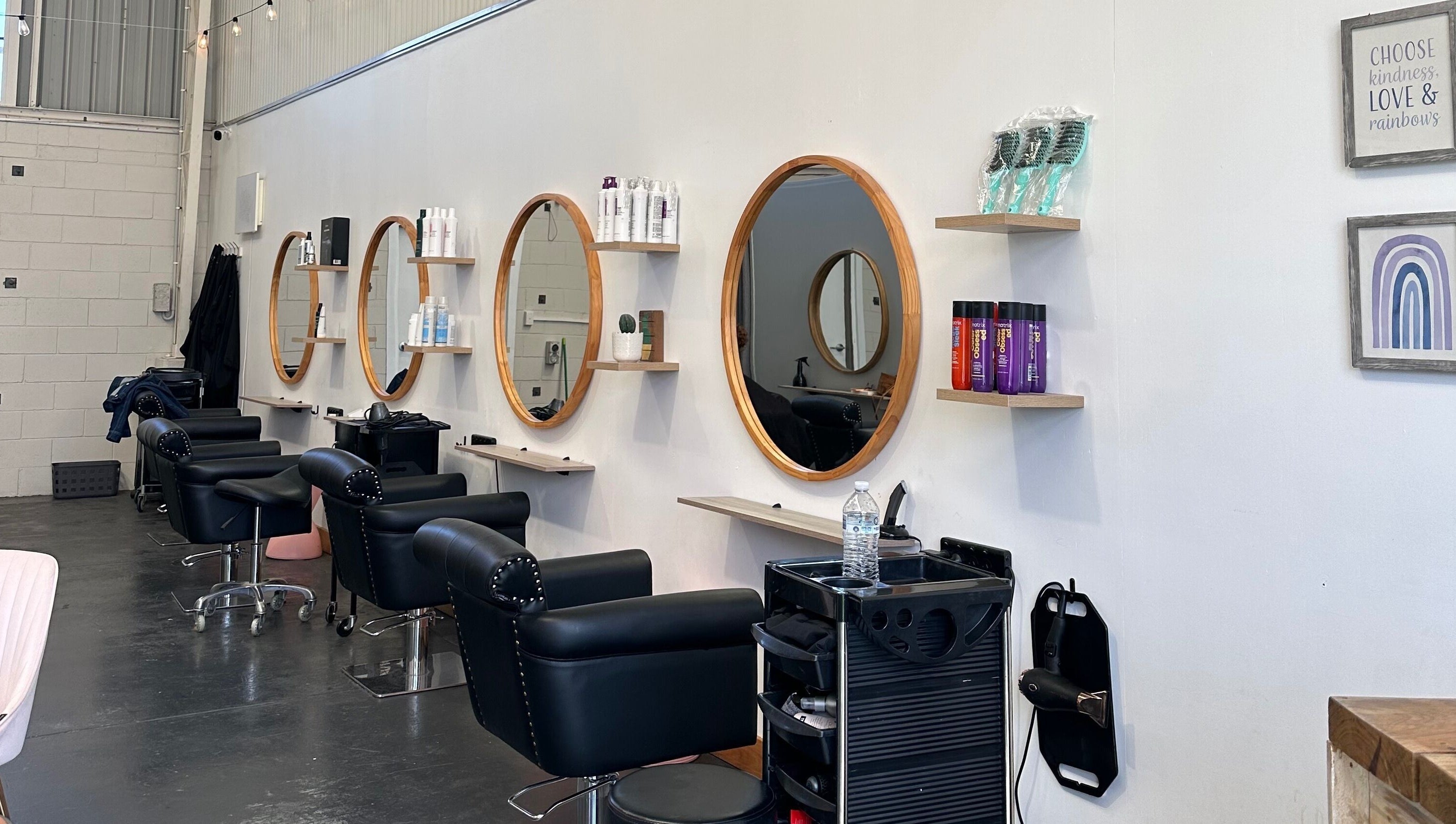 Stylish salon mirrors and chairs at Gracy RV in Yeerongpilly, Queensland, AU, showcasing modern design.