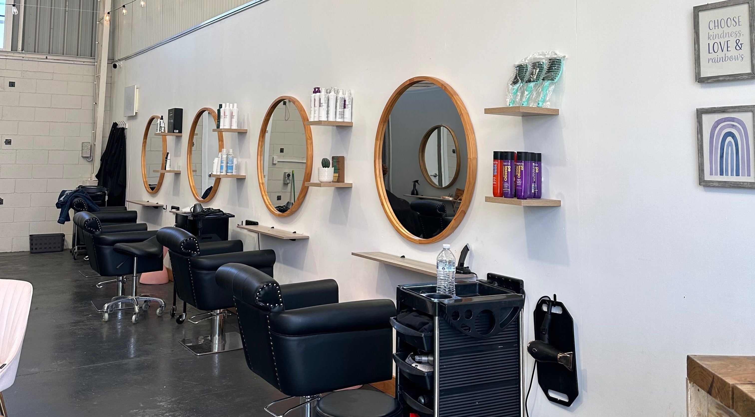 Stylish salon mirrors and chairs at Gracy RV in Yeerongpilly, Queensland, AU, showcasing modern design.