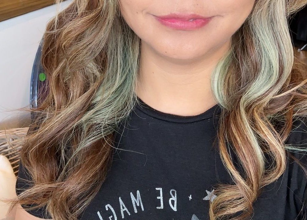 Elegant wavy hairstyle at Gracy RV, Yeerongpilly, Queensland, AU showcasing layered blond highlights.