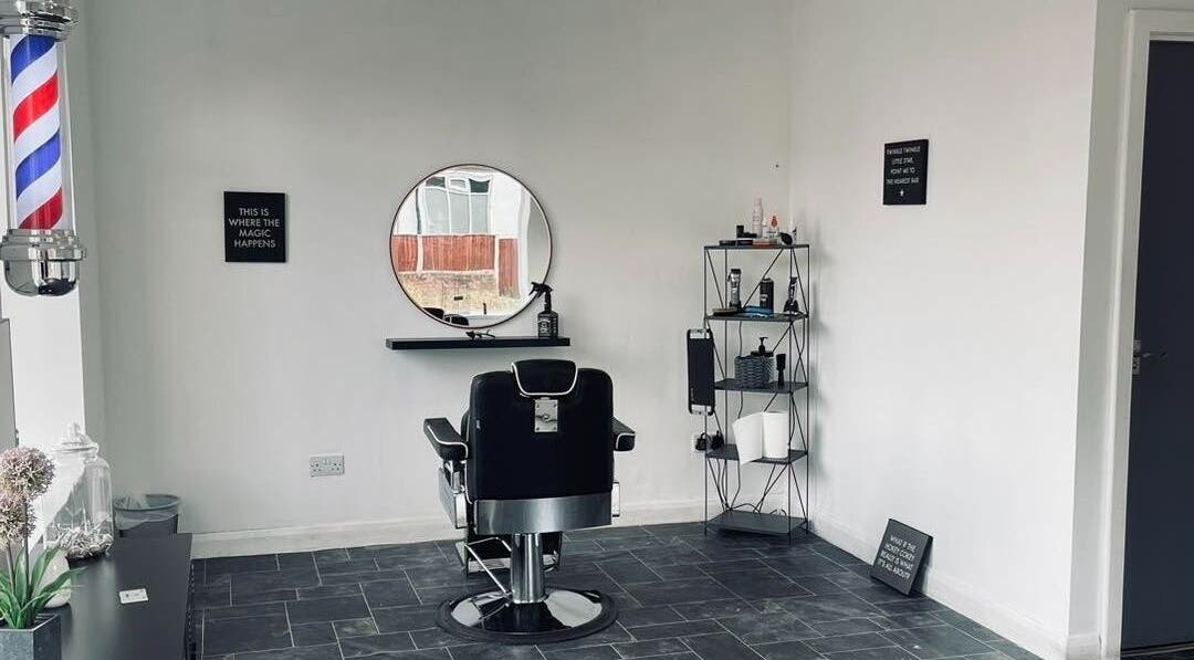 Modern chair and mirror setup in Eden At Jacks Barbers, Clipstone, England, GB.
